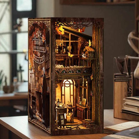 Hands assembling a DIY book nook kit with tools and pieces on a workspace